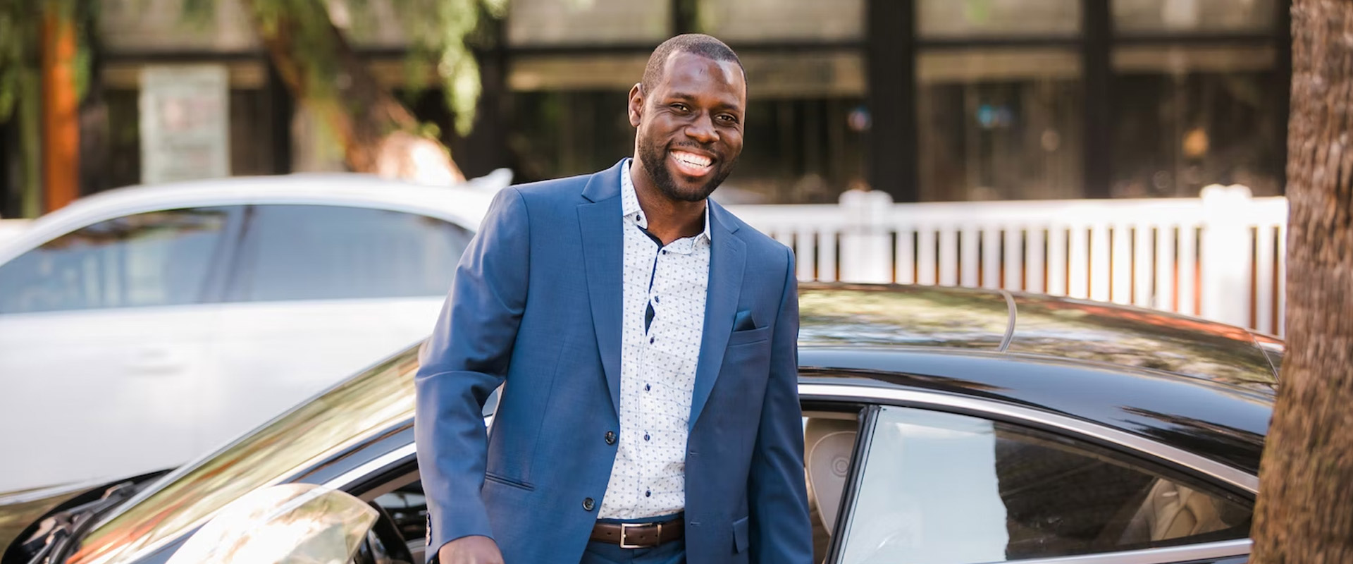 Business man in front of car