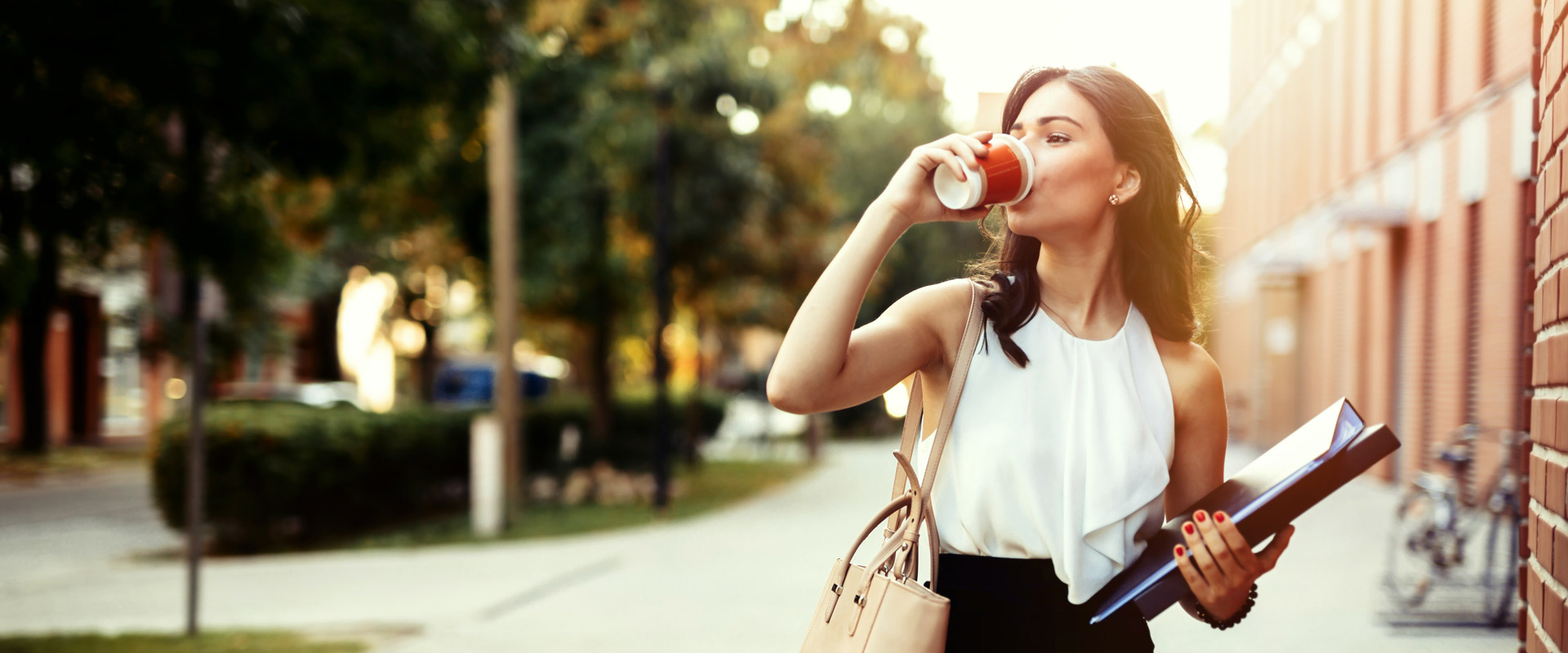 Business woman walking in the city